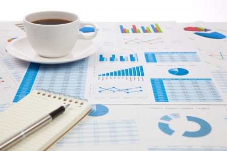 Business report with cup of coffeeの写真素材