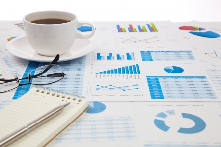 Business report with cup of coffeeの写真素材