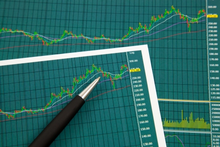 A pen on the Stock chart and financial reportの写真素材