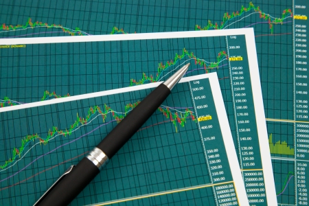 A pen on the Stock chart and financial reportの写真素材