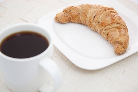 Croissant and a cup of coffeeの写真素材