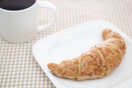 Croissant and a cup of coffeeの写真素材