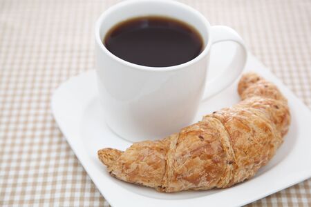 Croissant and a cup of coffeeの写真素材