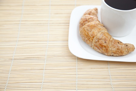 Croissant and a cup of coffeeの写真素材