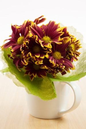 Flower bouquet in a white mugの写真素材