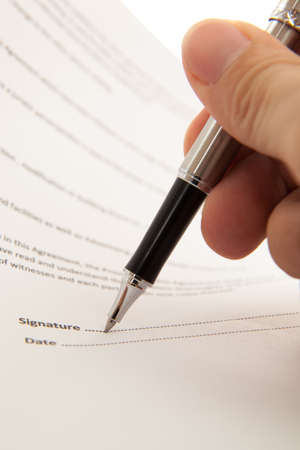Man hand signing a contractの写真素材