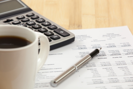 Business report. Cup of coffee on document.の写真素材