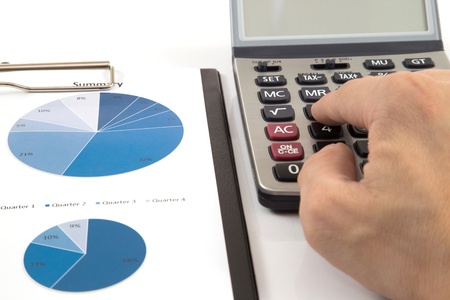 Businessman's hand showing diagram on financial reportの写真素材