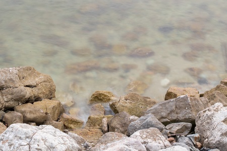 Waves crushing into the rocksの写真素材
