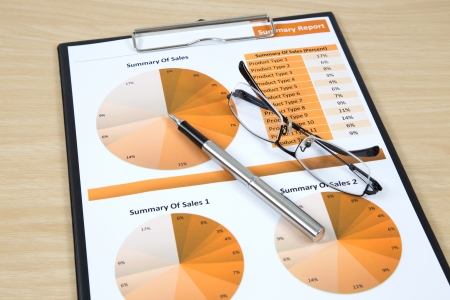 Graphs, charts, business report on table.の写真素材