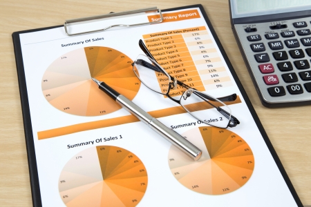 Graphs, charts, business report on table.の写真素材