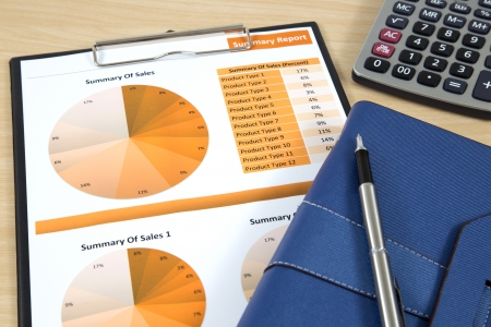 Graphs, charts, business report on table.の写真素材