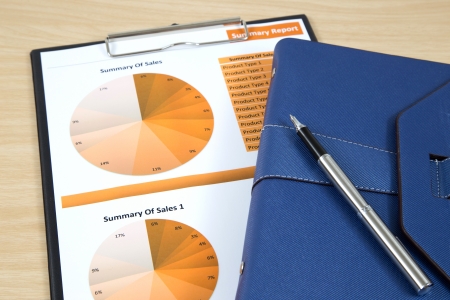 Graphs, charts, business report on table.の写真素材