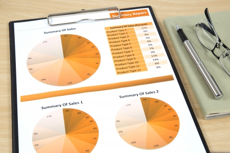 Graphs, charts, business report on table.の写真素材