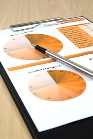 Graphs, charts, business report on table.の写真素材