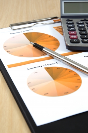 Graphs, charts, business report on table.の写真素材