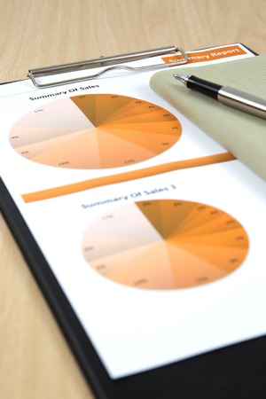 Graphs, charts, business report on table.の写真素材