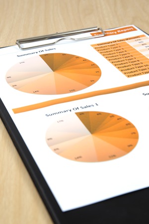 Graphs, charts, business report on table.の写真素材
