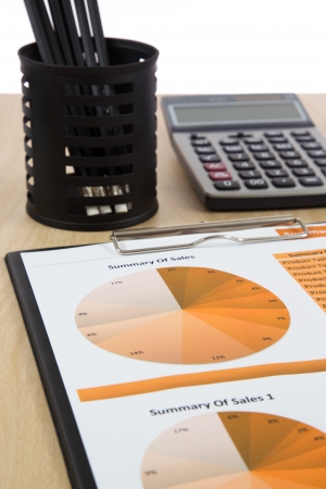 Graphs, charts, business report on table.の写真素材
