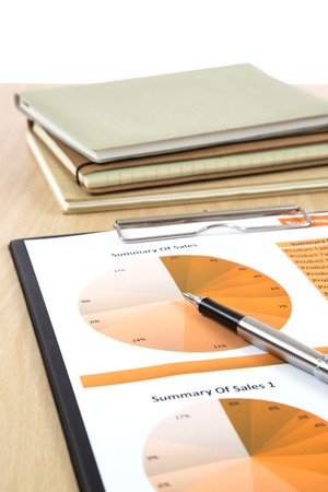 Graphs, charts, business report on table.の写真素材