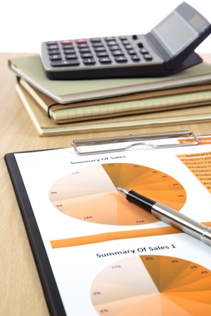Graphs, charts, business report on table.の写真素材