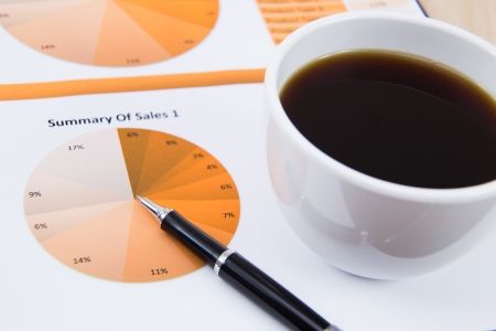 Financial report with calculator on tableの写真素材