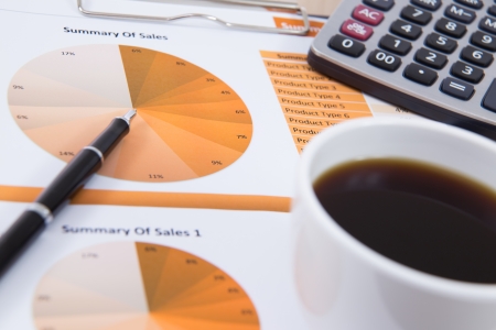 Financial report with calculator on tableの写真素材