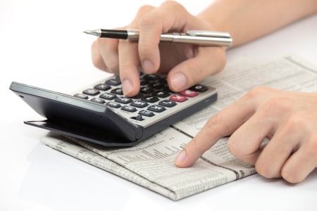 Business finance man calculating budget numbersの写真素材