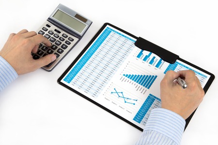 graphs and charts analyzed by businessmanの写真素材