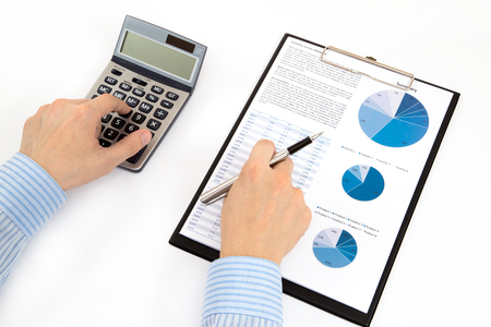 graphs and charts analyzed by businessmanの写真素材