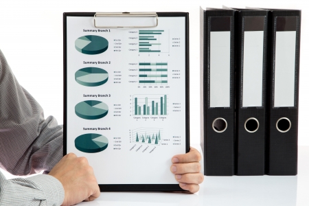 Graphs and charts analyzed by businessmanの写真素材