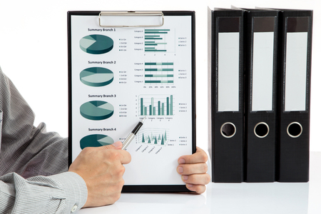 Graphs and charts analyzed by businessmanの写真素材