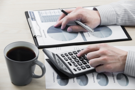 Business chart showing financial success with coffeeの写真素材