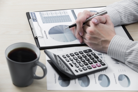 Business chart showing financial success with coffeeの写真素材