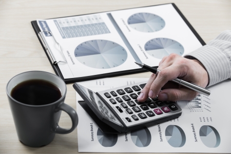 Business chart showing financial success with coffeeの写真素材