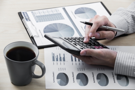 Business chart showing financial success with coffeeの写真素材