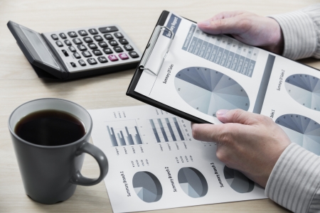 Business chart showing financial success with coffeeの写真素材