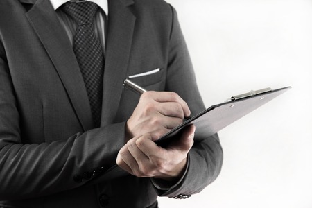 Accounting.Business records in the men's hands. isolated on whiteの写真素材