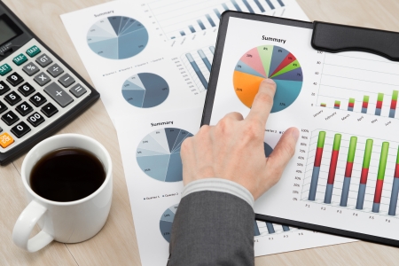 business report and man hand with penの写真素材