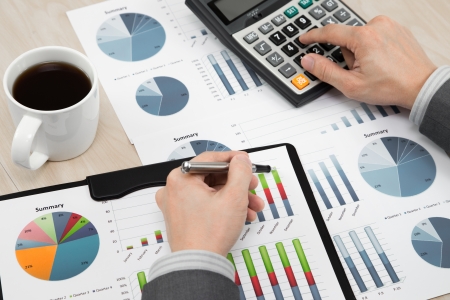 business report and man hand with penの写真素材