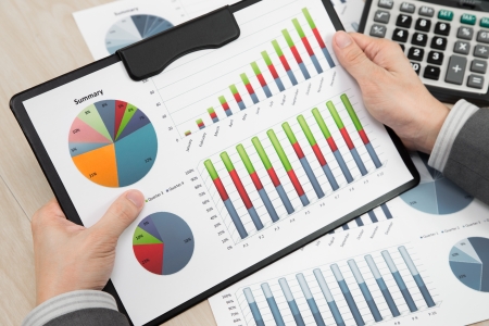 business report and man hand with penの写真素材