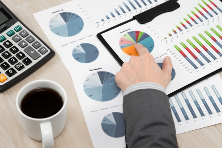 business report and man hand with penの写真素材