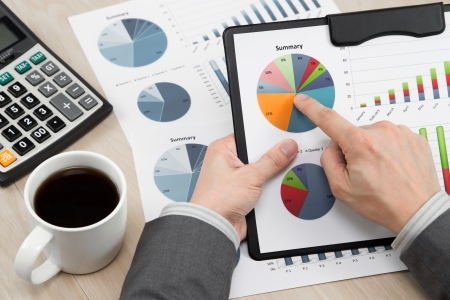 business report and man hand with penの写真素材
