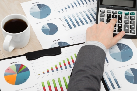 business report and man hand with penの写真素材