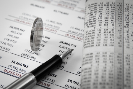 Thai money coins on a financial report