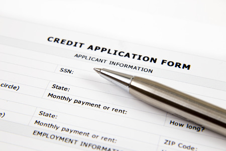 Blank Credit Application Form And Pen on desktopの写真素材
