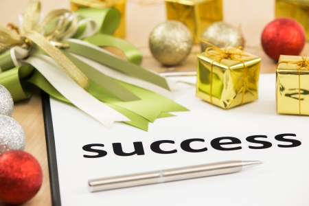 Text success with ribbon and gift close-upの写真素材