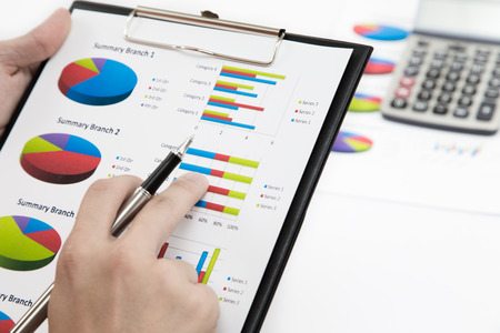 Stock market graphs and charts with penの写真素材