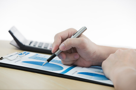 man hand with pen and business reportの写真素材