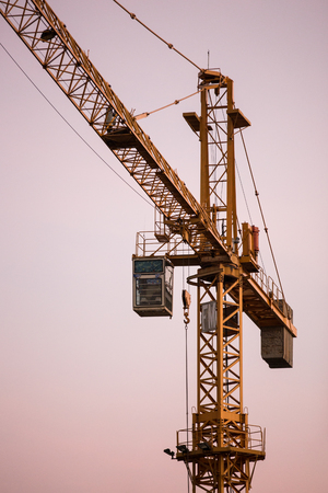 Yellow construction tower craneの写真素材